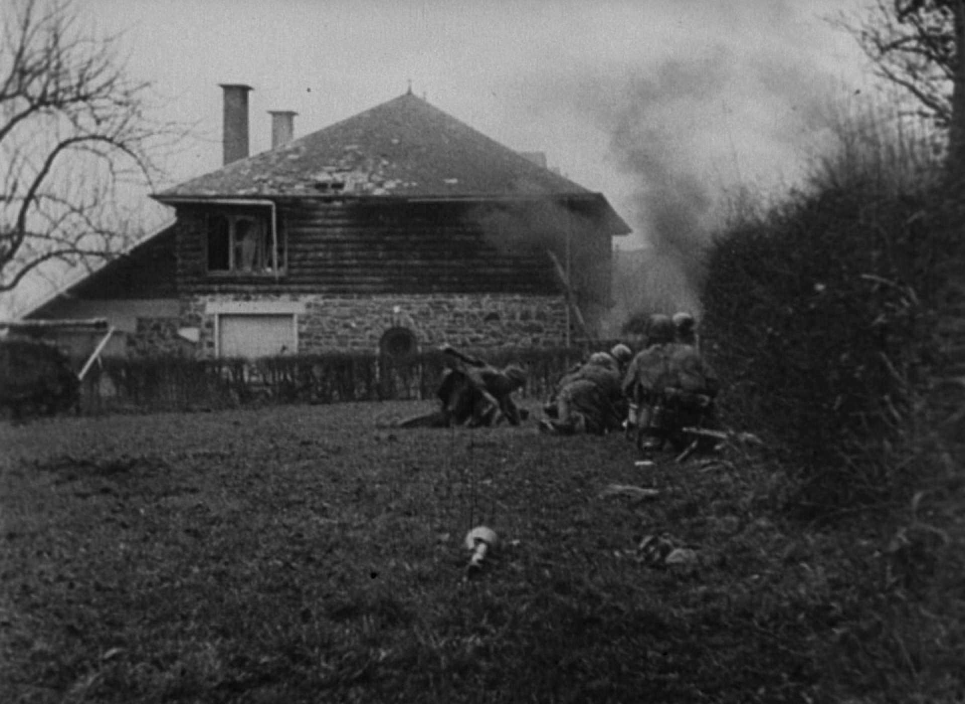 Fallschirmjager take cover from American fire as they attempt to aid a wounded man.