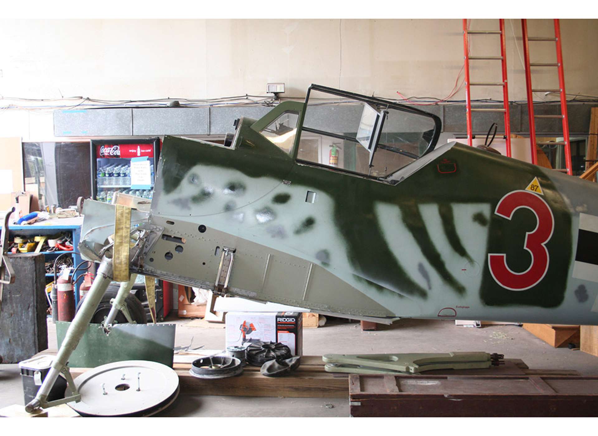 Bf 109 receives attention before moving to the Campaigns of Courage Pavilion.