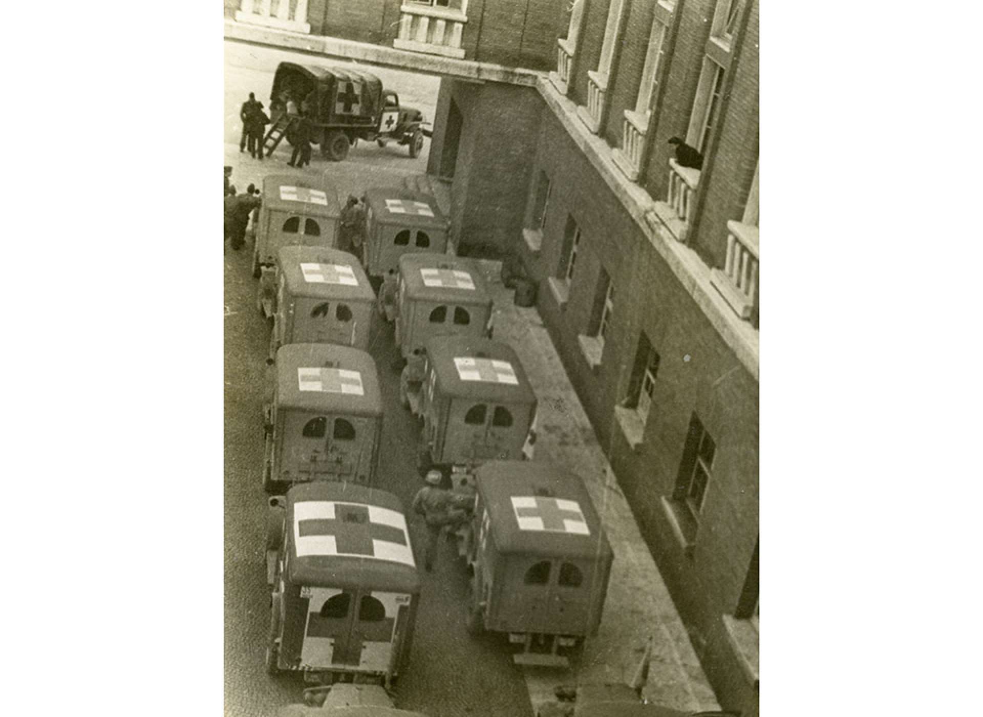 Ambulances lined up outside of the hospital in Florence. The original caption echoes Lt. Col. Miller’s experience there: “Florence, pts (patients) in, pts out.” The National WWII Museum