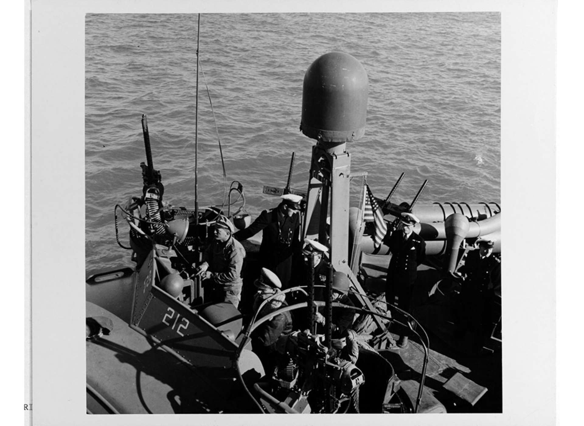 British Royal Navy Officers standing on the deck of PT-212.