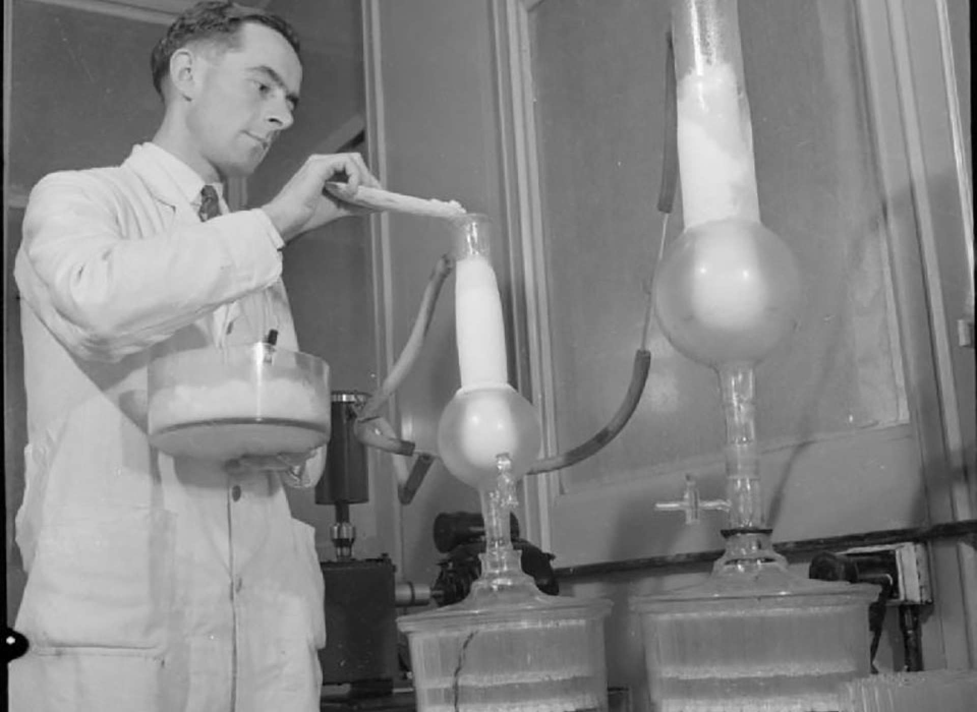 A technician from Merck purifying penicillin in 1942. From the Imperial War Museum 43467, in the public domain.