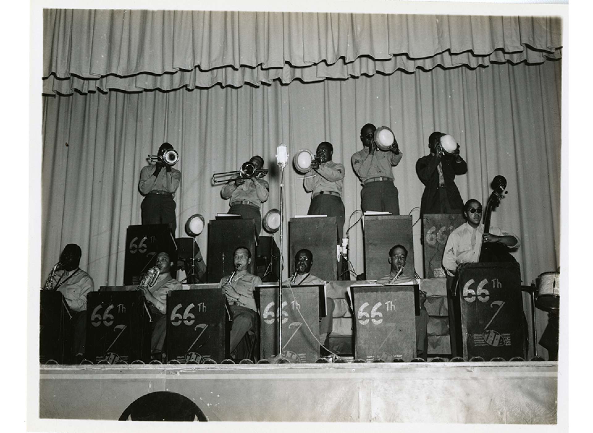 Members of the 66th M. T. B. playing at the Abilene, Texas, Air Force Base. Credit: Gift of Maxwell Garret, Accession Number: 2009.353.003 from the Collection of the National World War II Museum. 