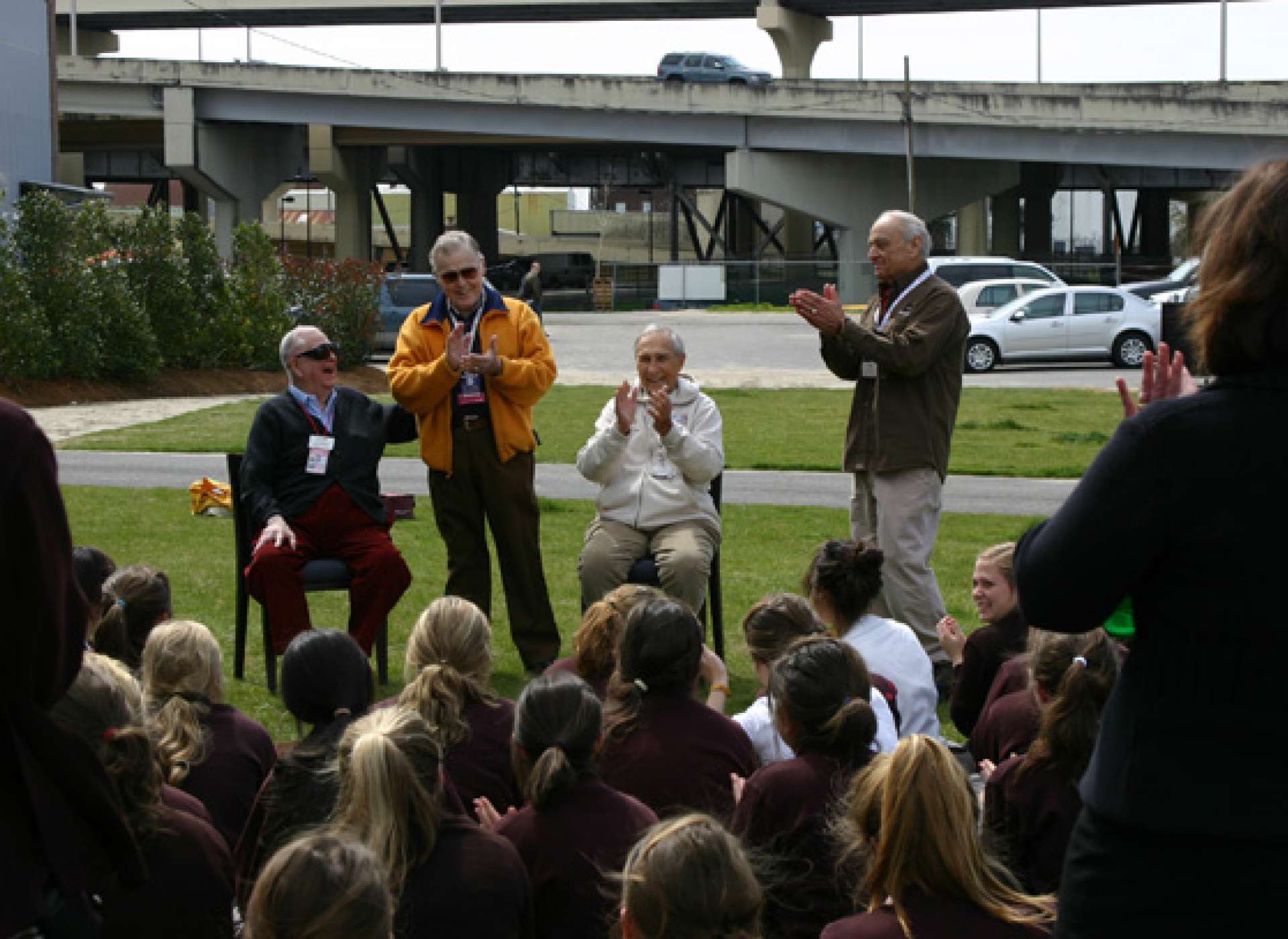 Vernon Main (second from left) and members of the “A-Team” visit with an appreciative school group on the Museum grounds.