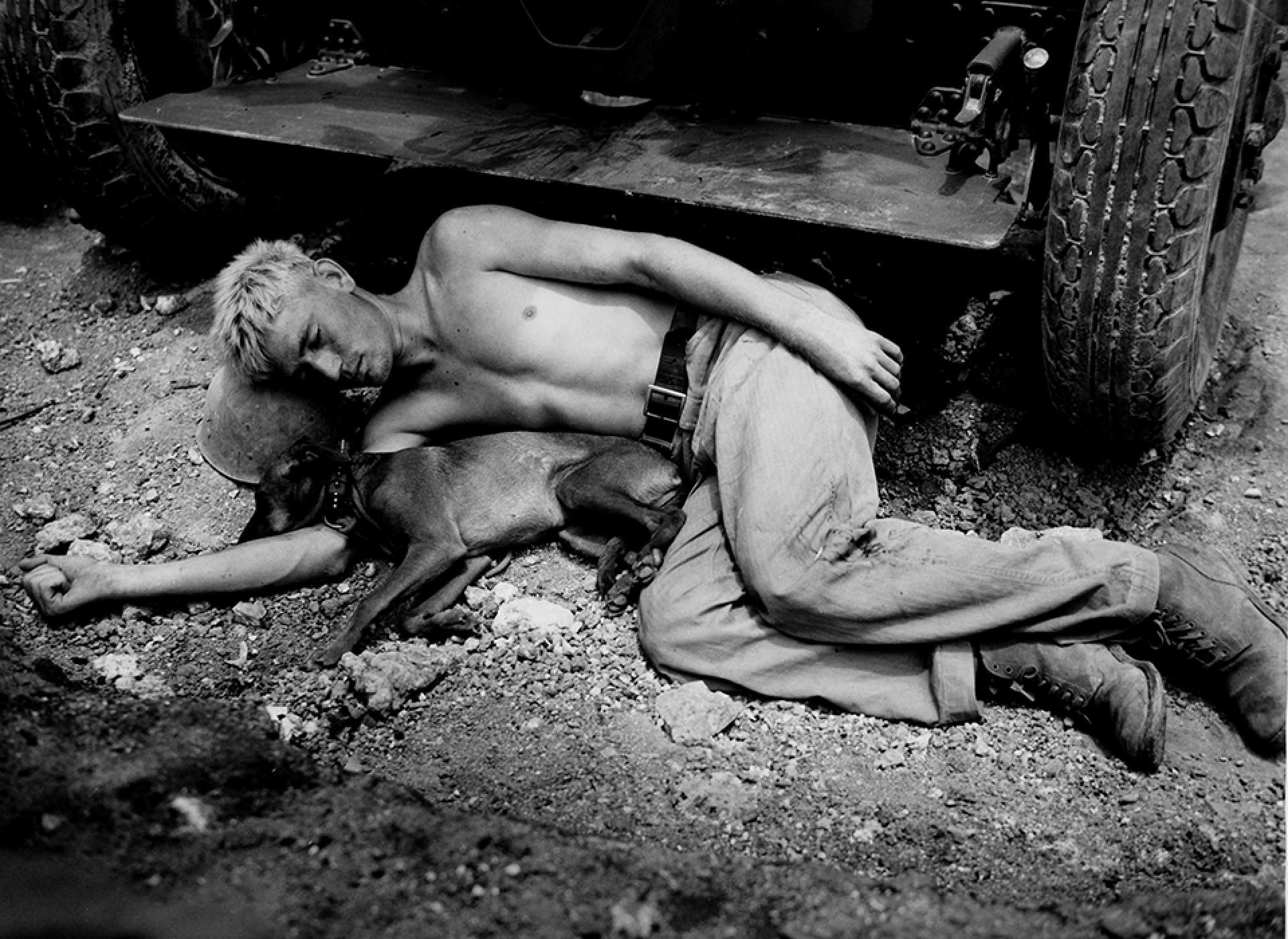 A marine and his dog sleep wherever and whenever possible—here, in a foxhole on Okinawa. Time Life Pictures/Getty Images.