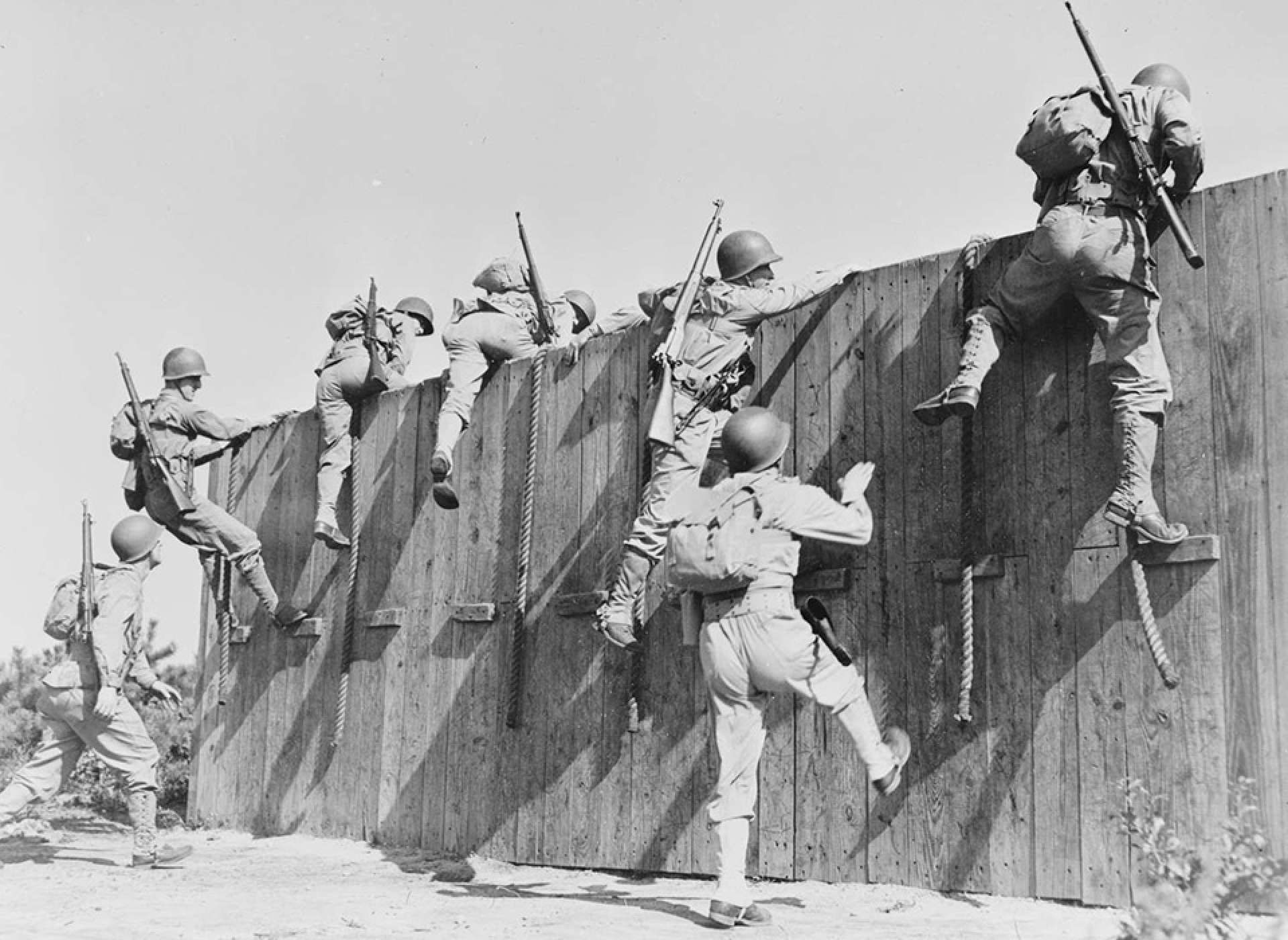Soldiers tackle part of an obstacle course at Camp Edwards, Massachusetts, 1942.