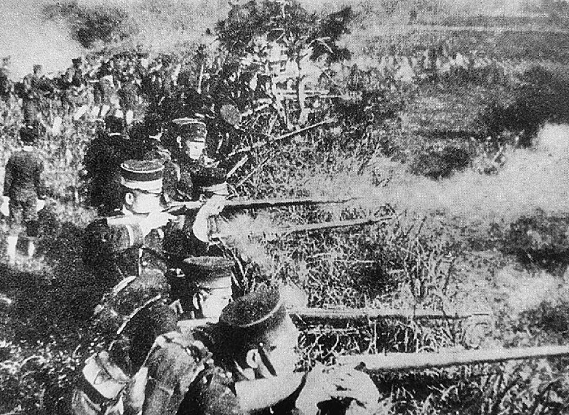 Soldiers of the Imperial Japanese Army firing their Murata Type 22 rifles