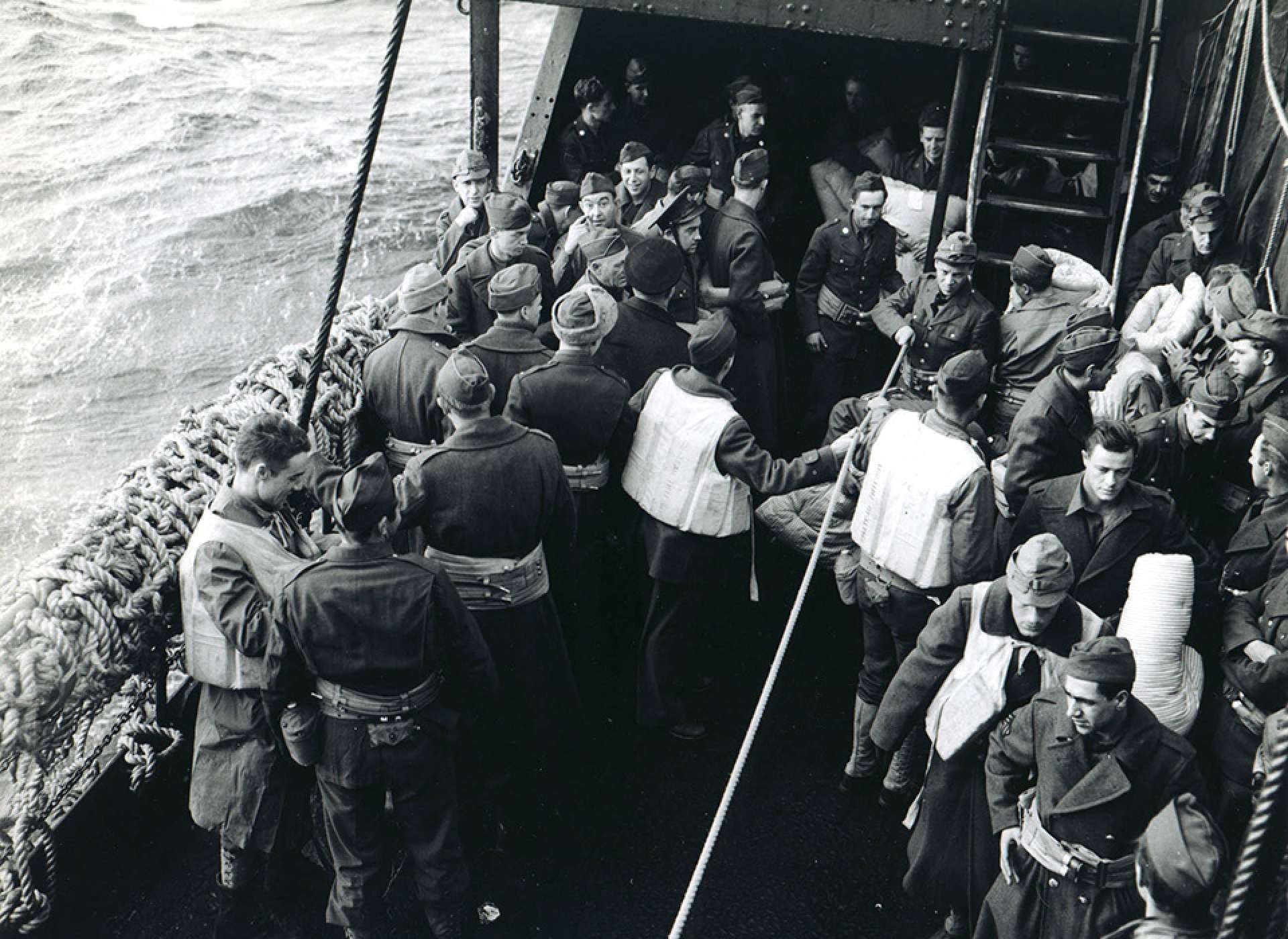 soldiers of the 34th Infantry Division practiced lifeboat drill while enroute to Northern Ireland