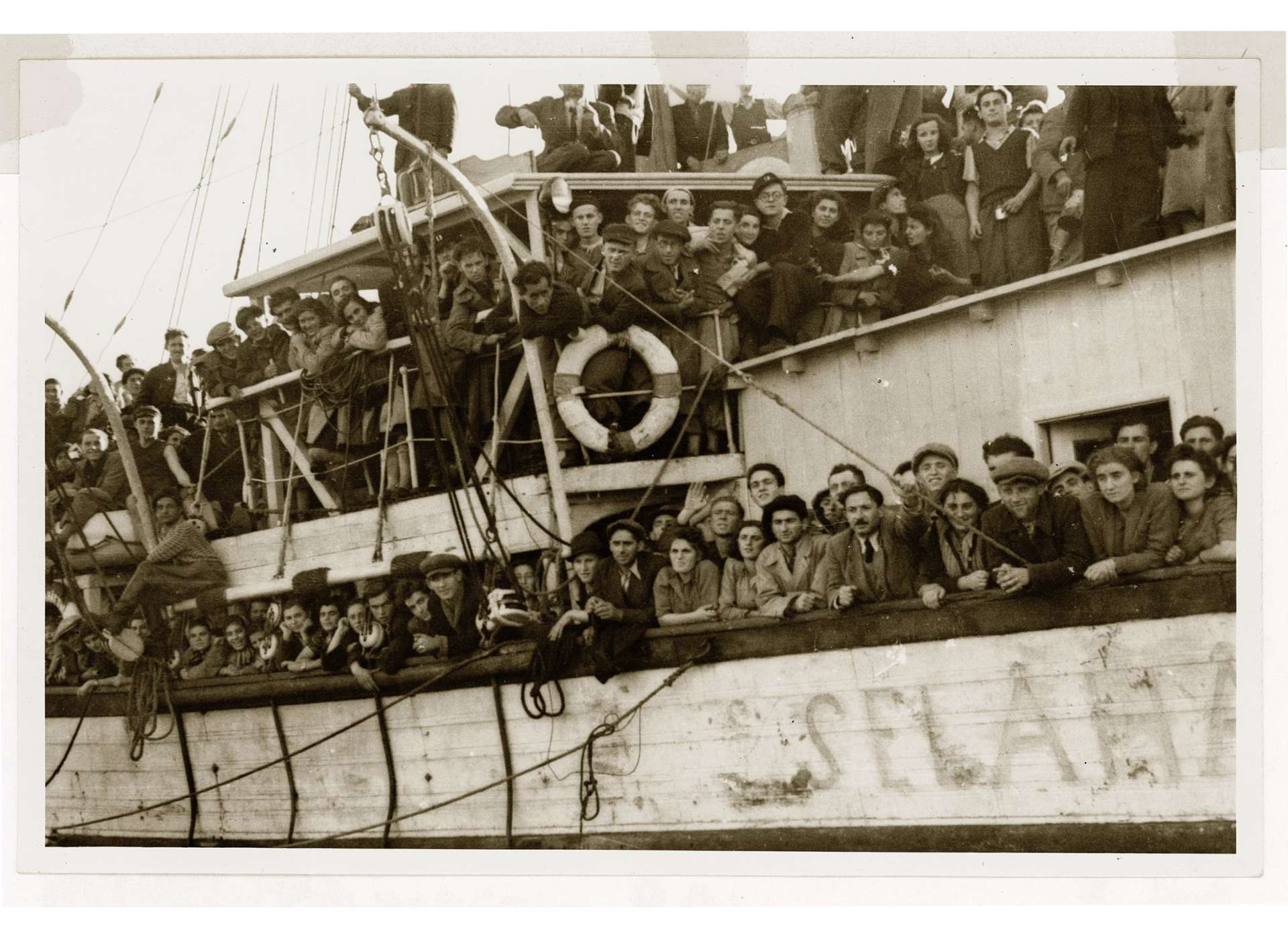 Hundreds of Romanian and Bulgarian Jewish passengers hang off the sides of the Selahattin, as the boat reaches Istanbul. They were among the 8,000 refugees who transited through Turkey to Palestine in 1944. Courtesy of the Franklin D. Roosevelt Presidential Library and Museum, Hyde Park, New York