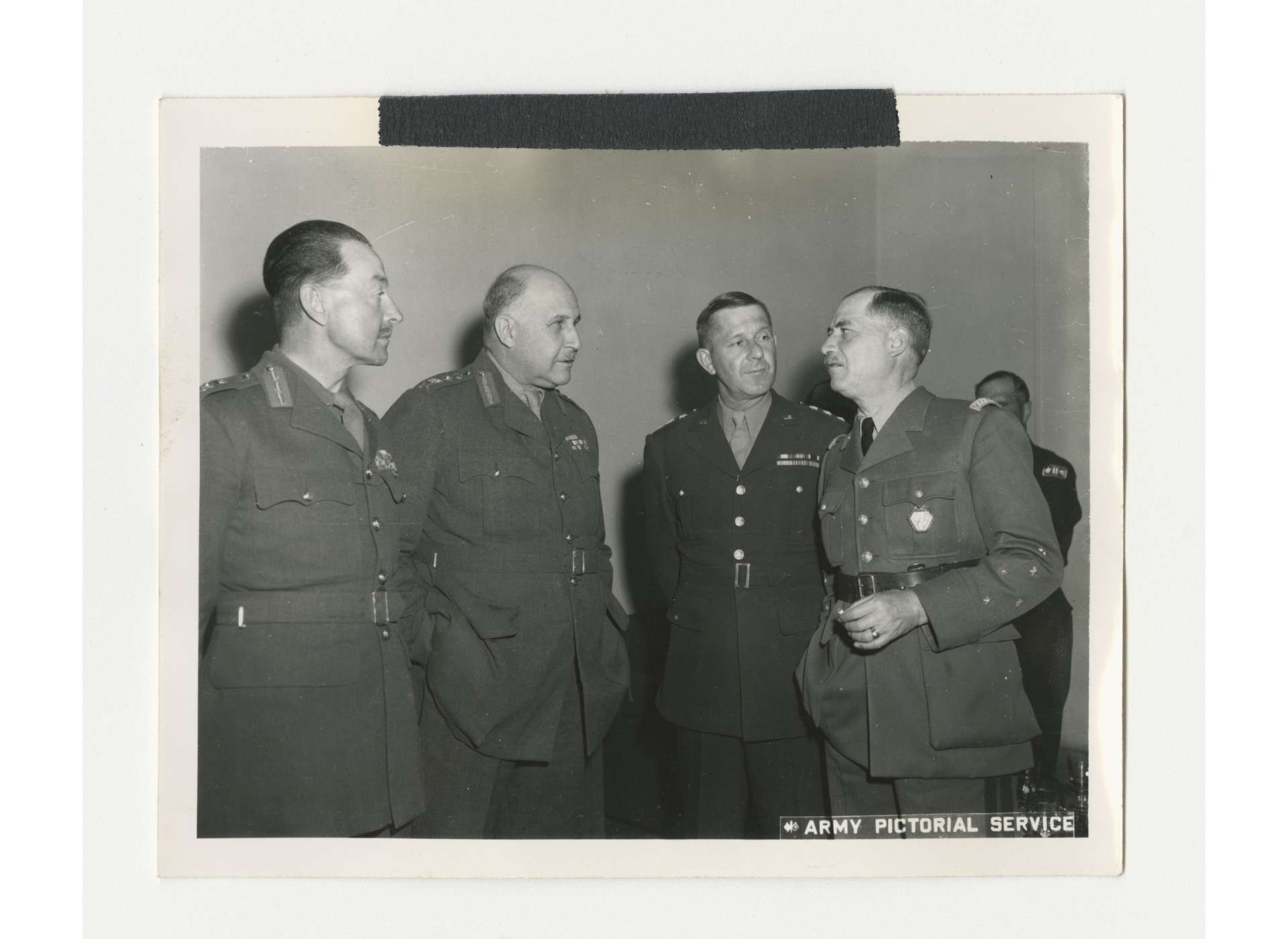 Meeting between, from left to right, British General Sir Harold Alexander, Commander in Chief of Allied Armies in Italy, British General Sir Henry Maitland Wilson, Supreme Allied Commander, Mediterranean Theater, US Lieutenant General Jacob Devers, Deputy Supreme Commander, Mediterranean Theater, and General Alphonse Juin, Commander of the Free French Expeditionary Corps, April 25, 1944. US Army Signal Corps photo, gift from Ms. Regan Forrester, from the Collection of The National WWII Museum, 2002.337.505.