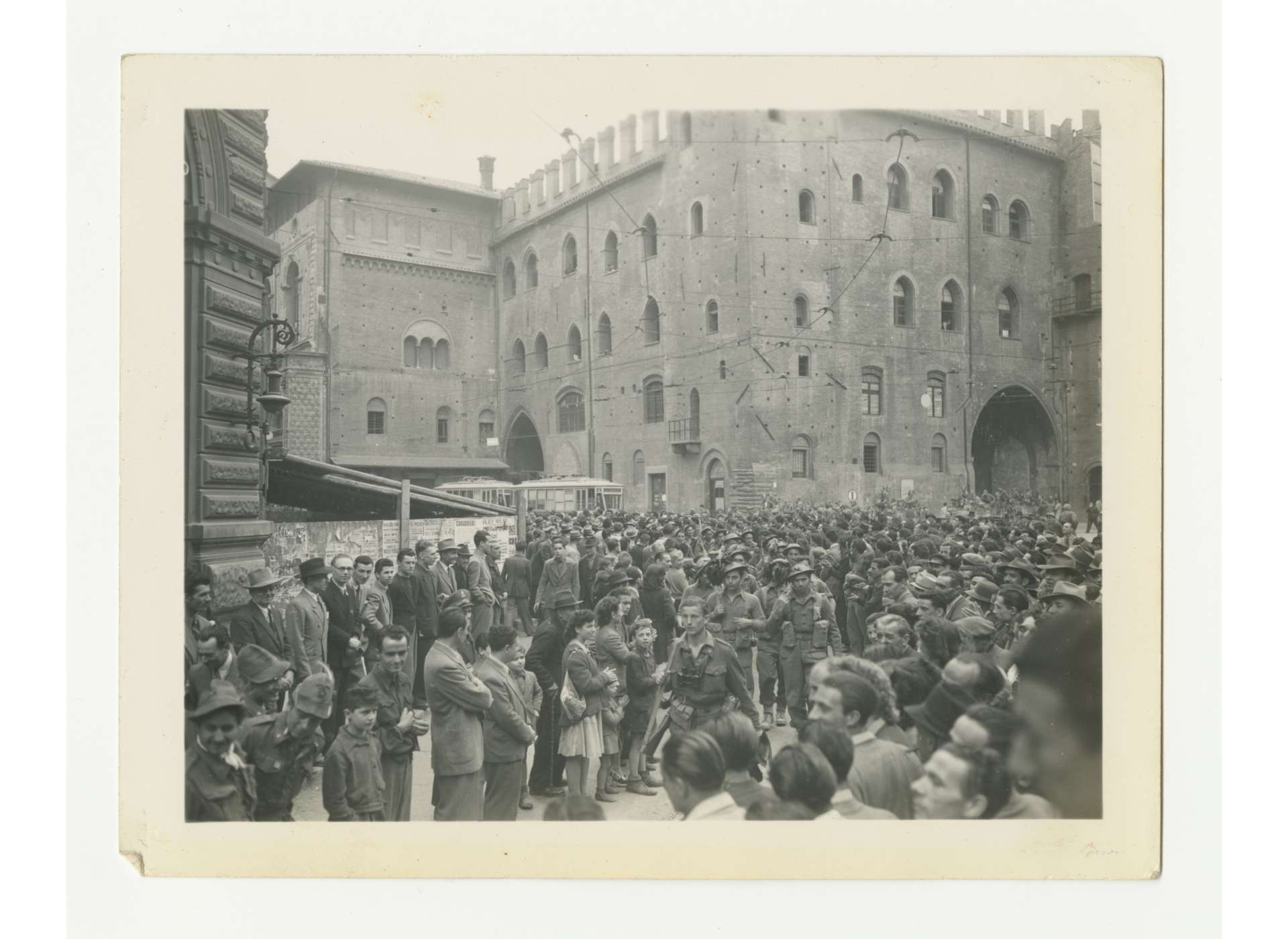 Italian troops serving with US Fifth Army enter liberated Bologna, April 21, 1945. US Army Signal Corps photo, in memory of William F. Caddell, Jr., from the Collection of The National WWII Museum, 2007.048.096.