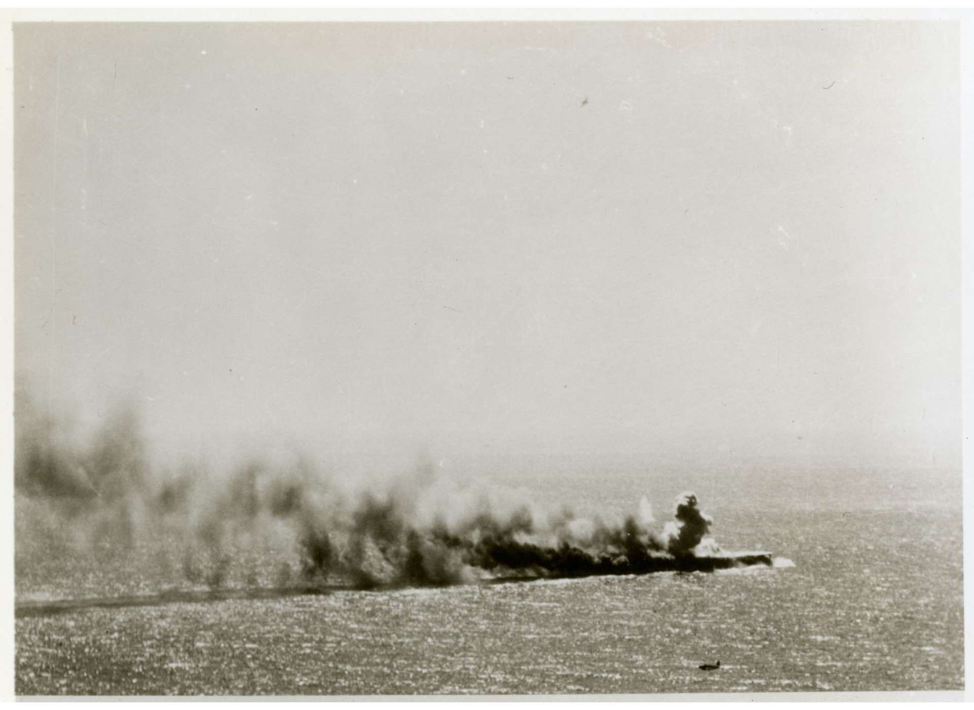 Smoke billowing from Japanese Carrier SHŌHŌ, Photo courtesy of The National WWII Museum, Gift in memory of Sgt. Lyle E. Eberspecher, 2013.495.381