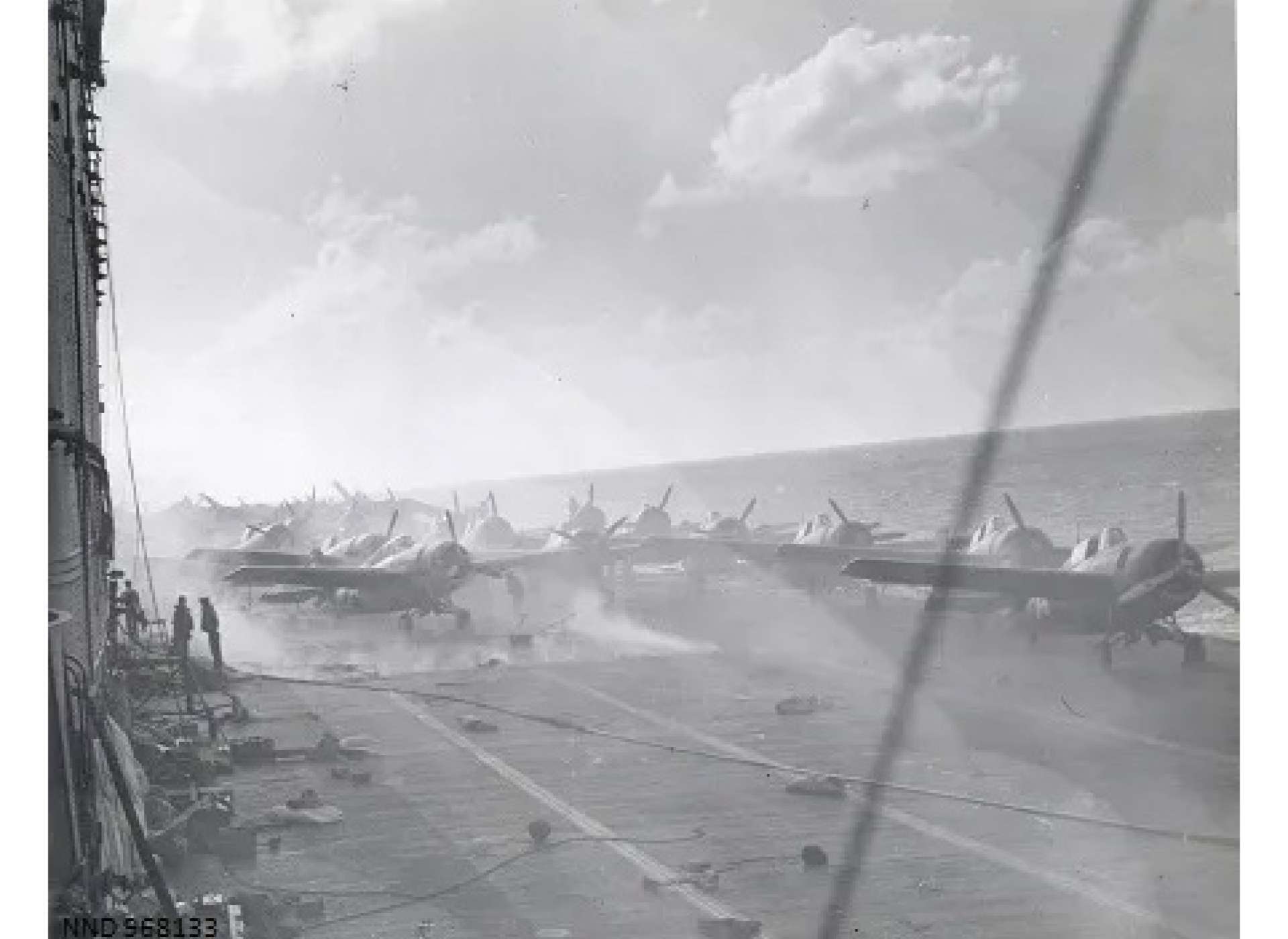 Deck of the Lexington just prior to the explosion, sometime after 1400 hours by which time all planes had been landed. Photo courtesy of the National Archives and Records Administration.