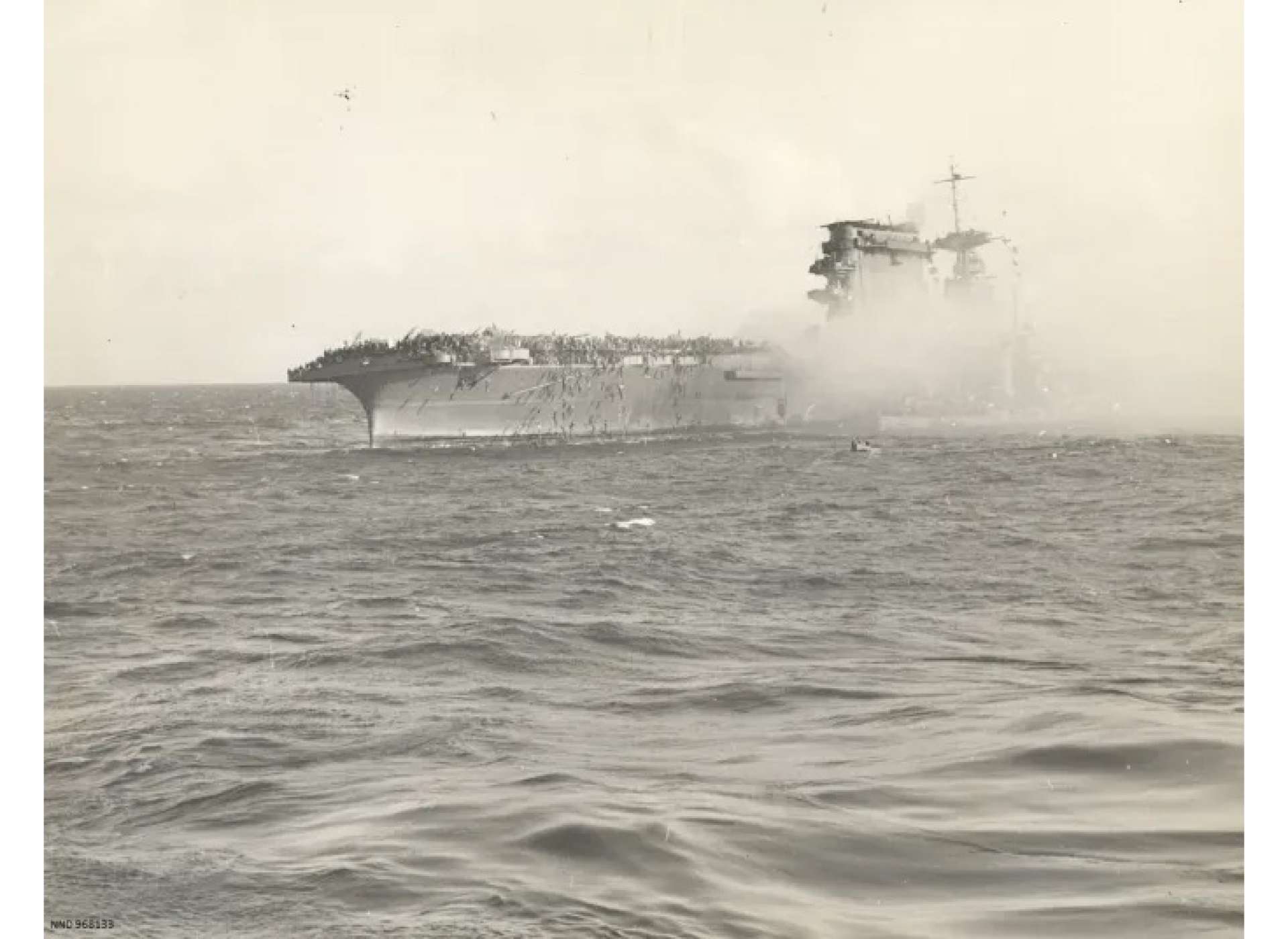 Lifeboats evacuating crew from USS Lexington. Photo courtesy of the National Archives and Records Administration.