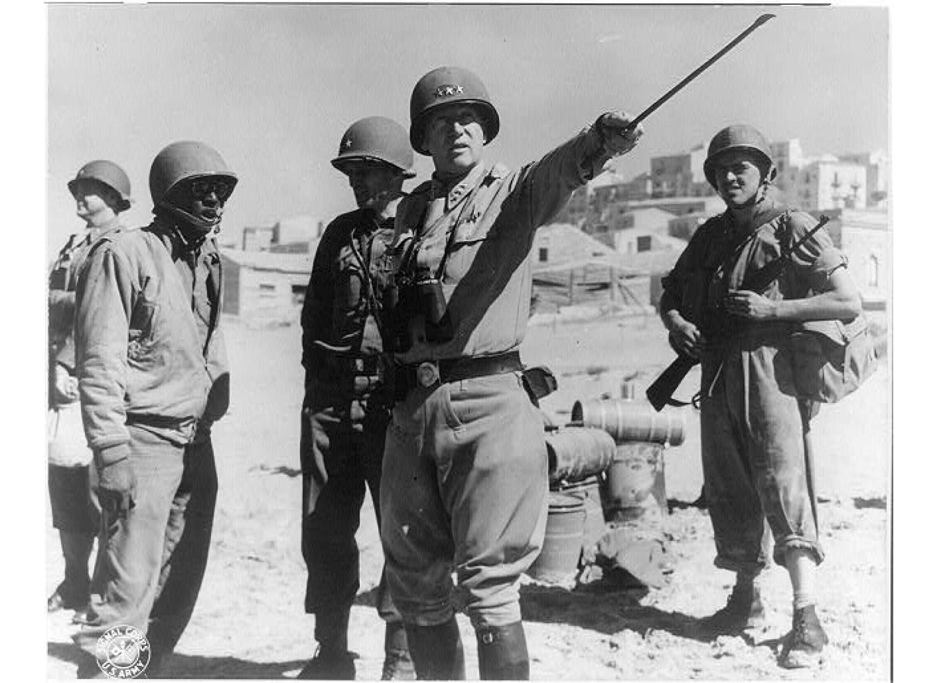 General George S. Patton, commander of US Seventh Army, instructing troops on Sicily, July 1943. US Army Signal Corps Photo No. 175663, 7-11-4, Library of Congress Prints and Photographs Division Washington, D.C. 20540 USA.