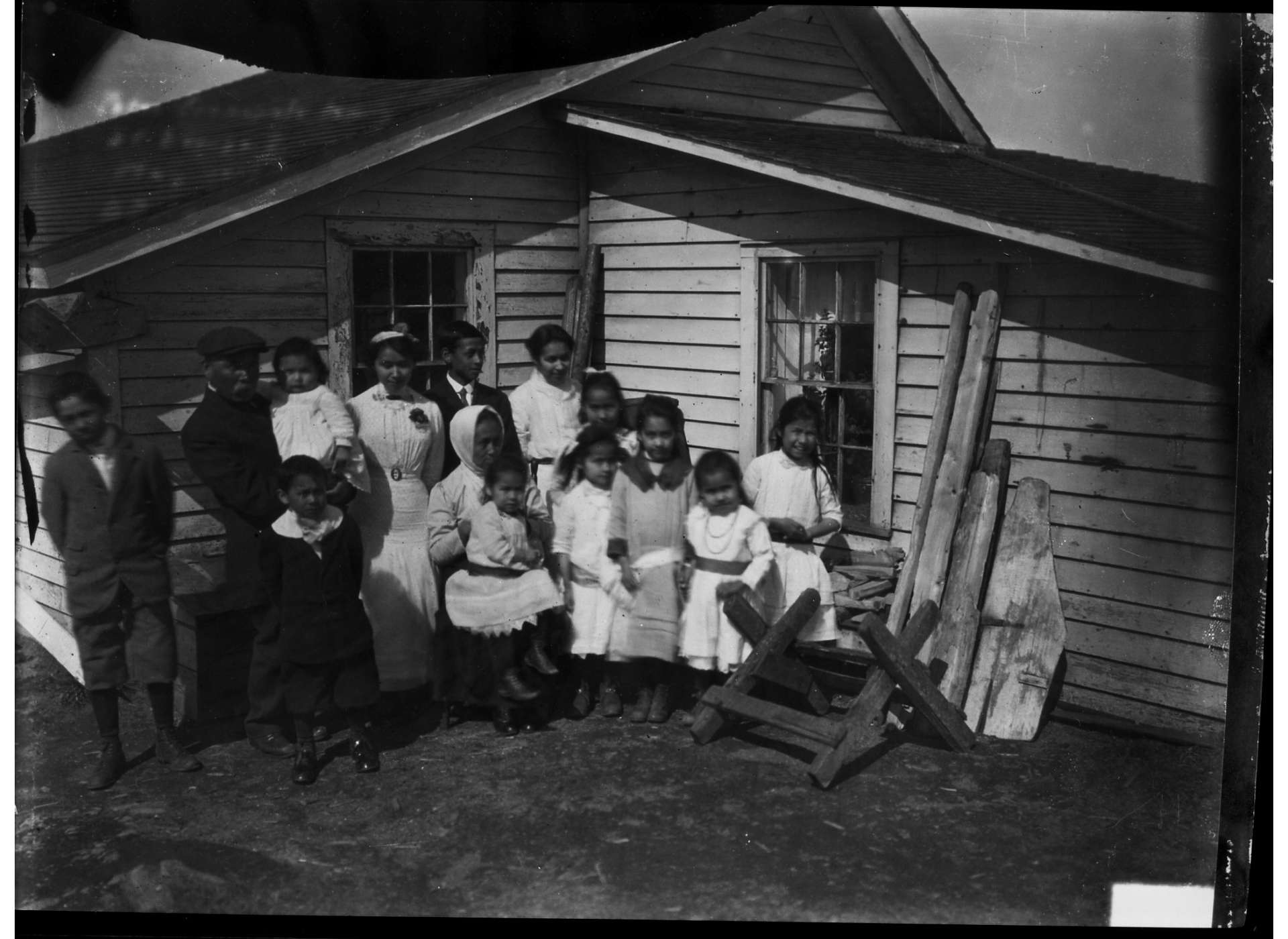 An Unangan family (possibly celebrating a wedding) from St. Paul Island, 1920s. Photographer G. Dallas Hanna. Courtesy of the National Archives and Records Administration.