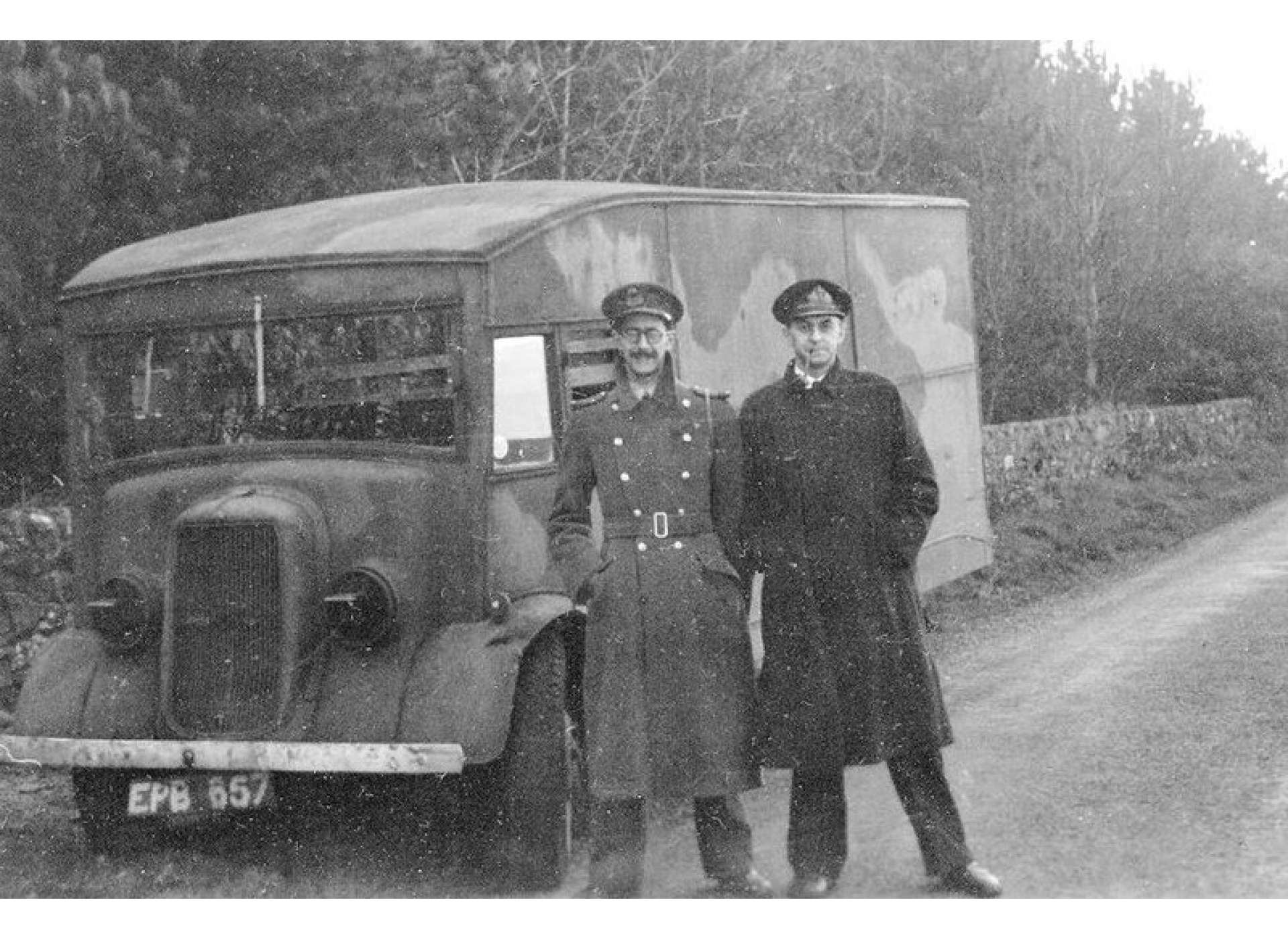 Charles Cholmondeley and Ewen Montagu on 17 April 1943, transporting the body to Scotland