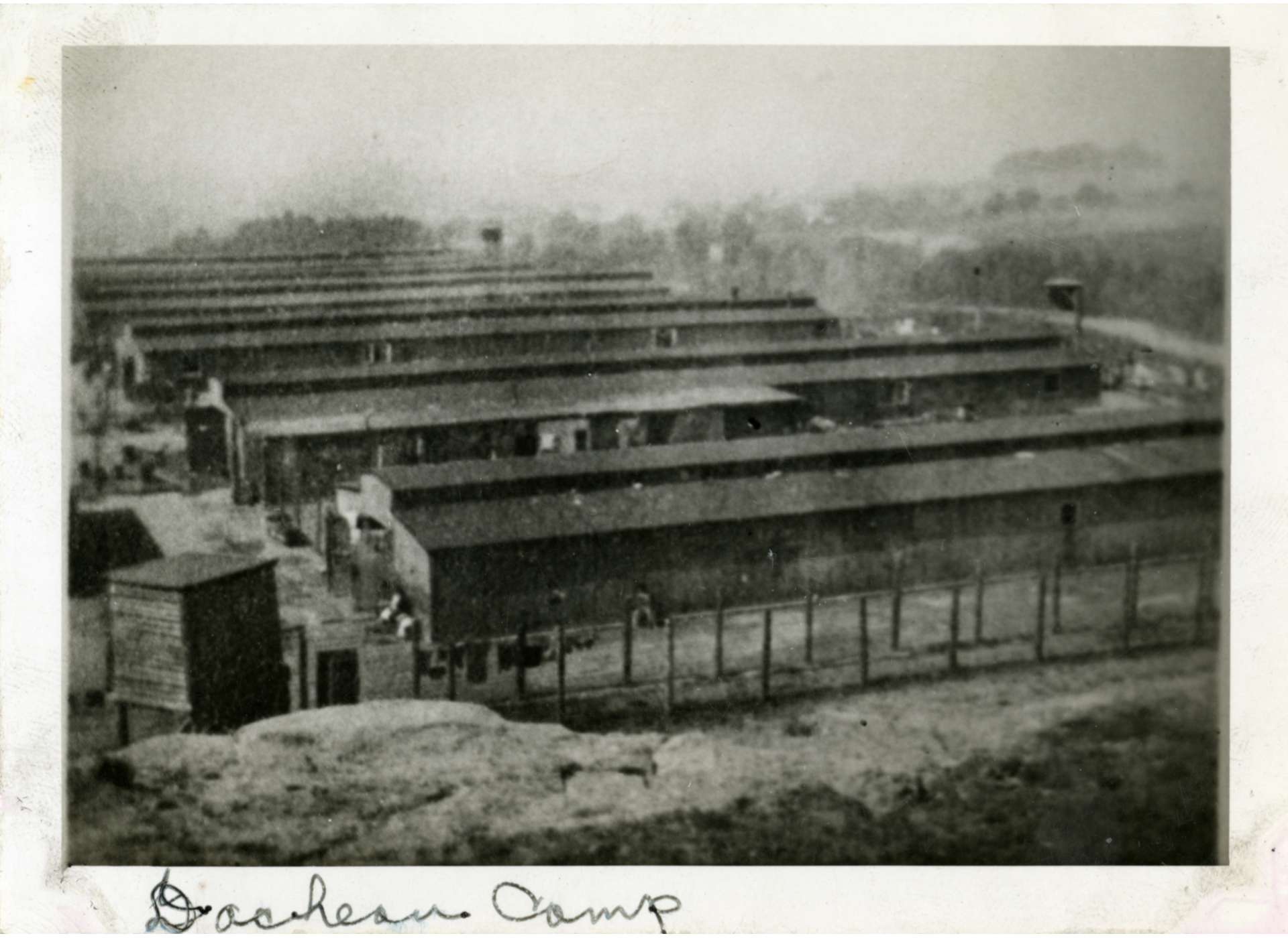 Barracks of the concentration camp at Dachau, 1945. Gift of Vincent Yannetti, from the Collection of The National WWII Museum, 2008.321.230.