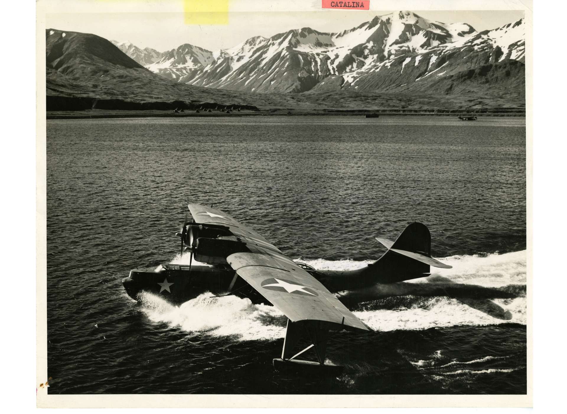 A PBY Catalina Flying Boat glides in for a landing. A similar aircraft was dispatched to Brooke’s Point, Palawan to fly seven Americans 850 miles over Japanese-held territory to General Douglas MacArthur’s headquarters on Morotai, an island south of the Philippines in the Dutch East Indies. US Navy Official Photograph, Gift of Charles Ives, from the Collection of The National World War II Museum, 2011.102.434.