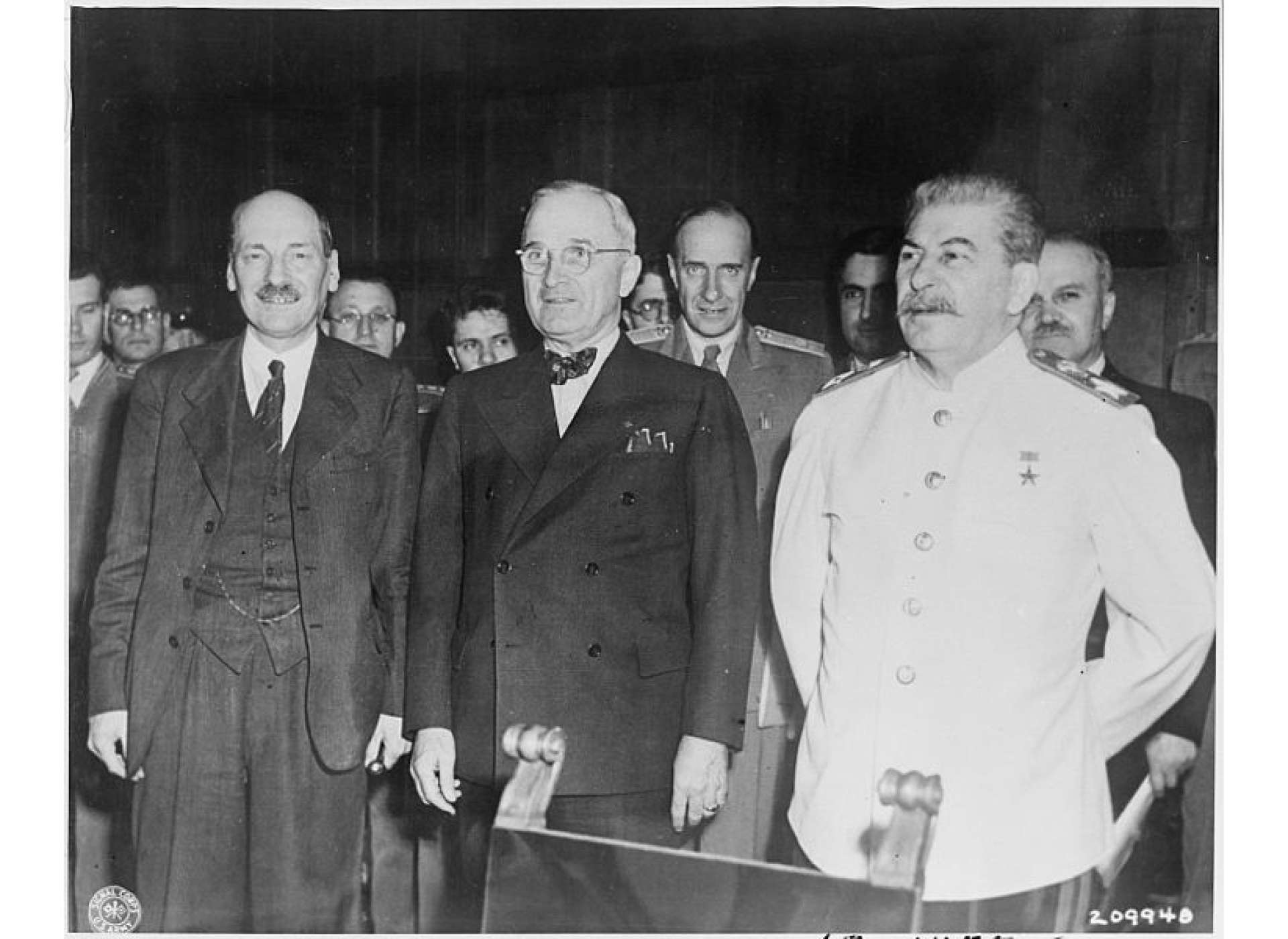 The new "Big Three" meet for the first time at the Potsdam Conference in Potsdam, Germany. Left to right: the new British Prime Minister Clement Attlee, President Harry S. Truman, and Soviet Prime Minister Josef Stalin. “The new Big Three meet for the first time at the Potsdam Conference,” July 29, 1945, National Archives and Records Administration, Office of Presidential Libraries, Harry S. Truman Library, (NAID) 198950.