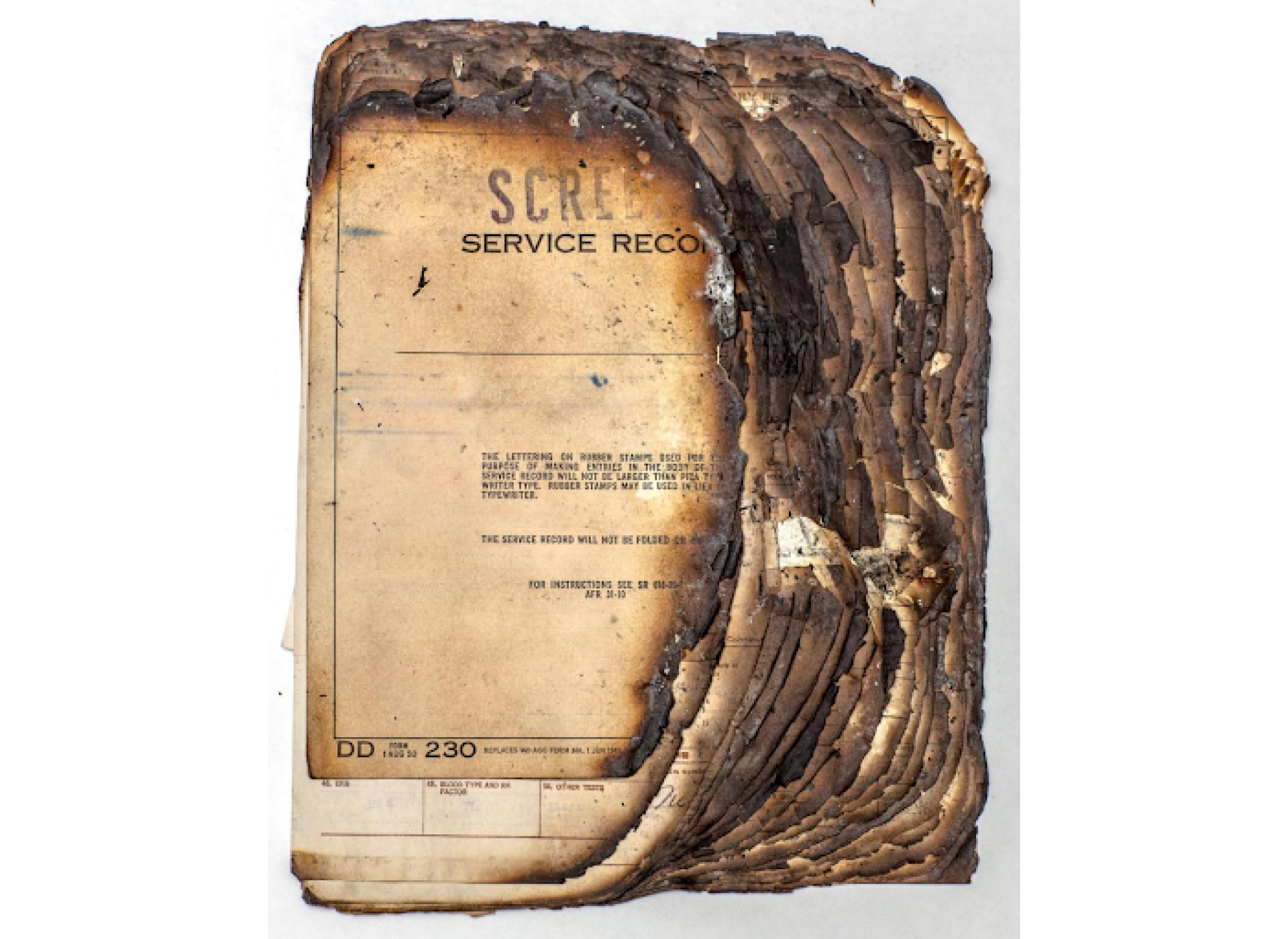 The remains of a veteran’s official military personnel file that was partially burned in the 1973 National Personnel Records Center fire. Courtesy of the National Archives and Records Administration.