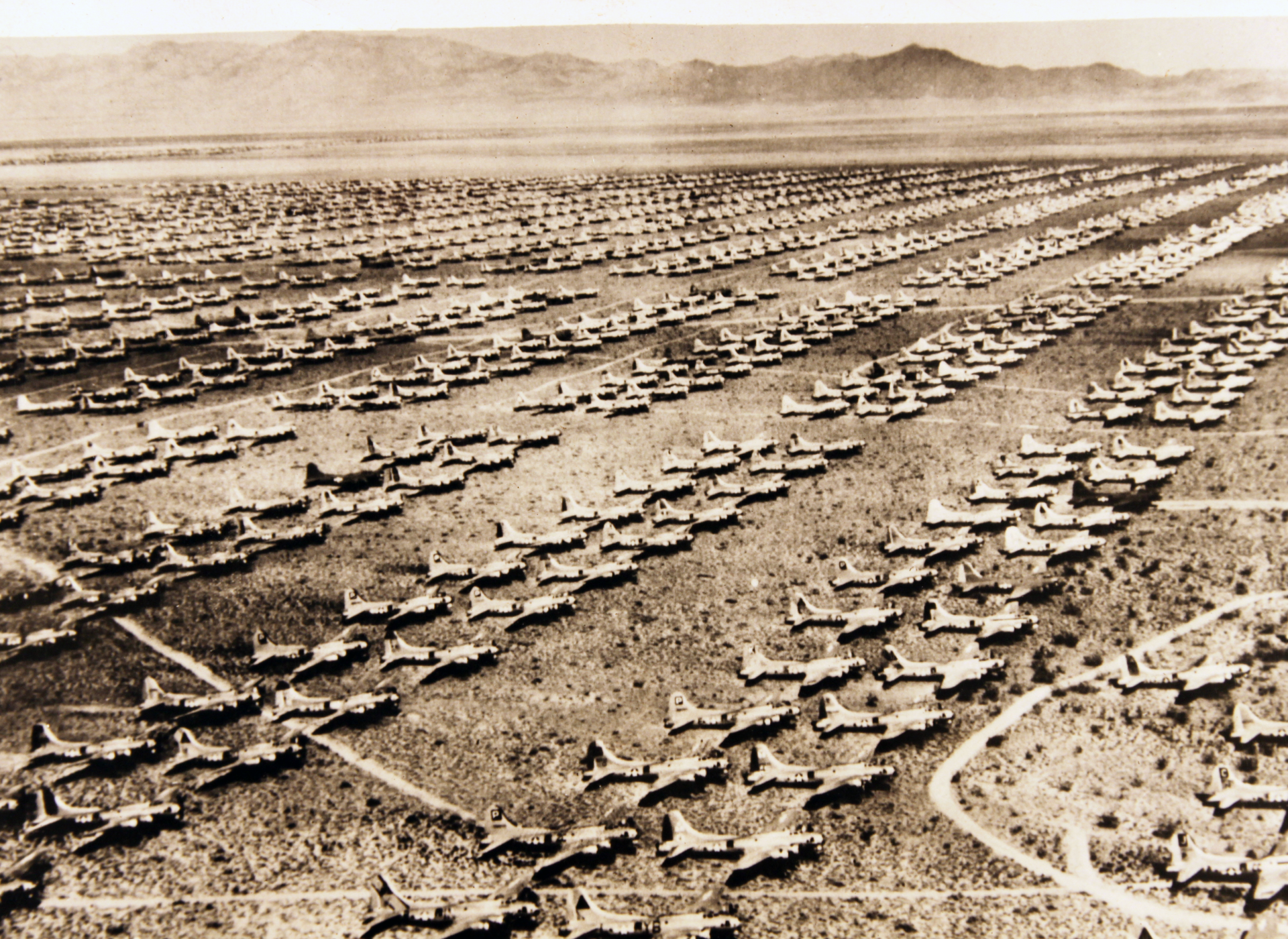 Rows of Boeing B-17 bombers—some of them nearly brand new—await their fate