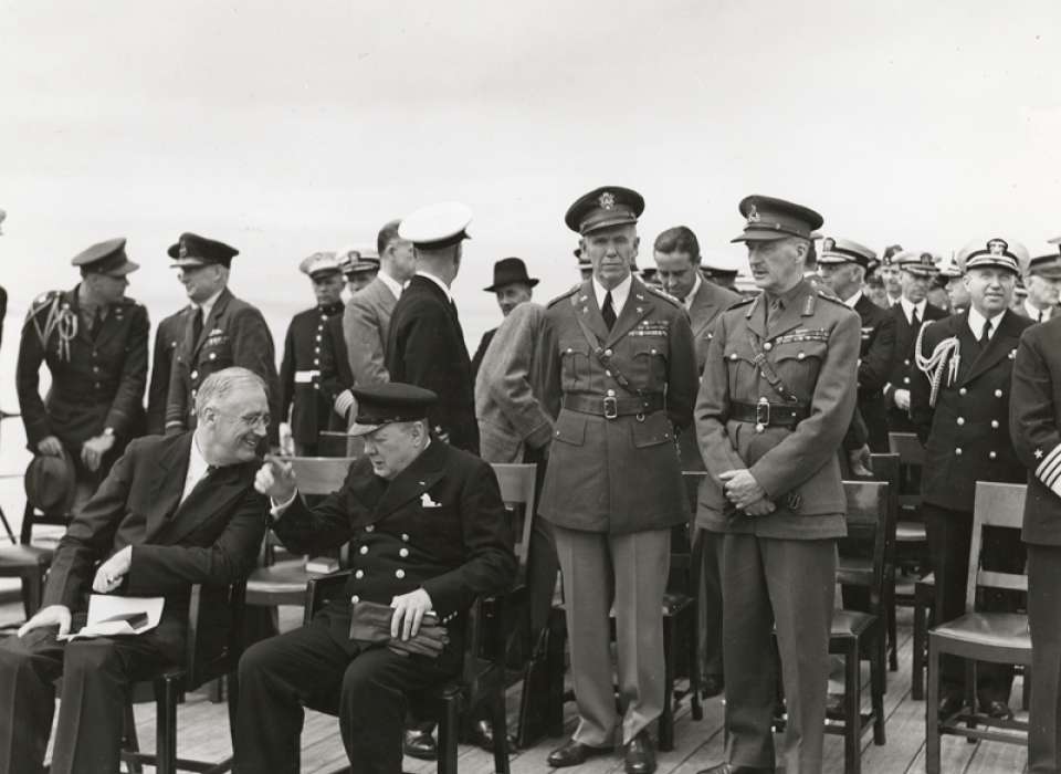 President Franklin Delano Roosevelt and British Prime Minister Winston Churchill meet aboard the HMS Prince of Wales during the Atlantic Conference