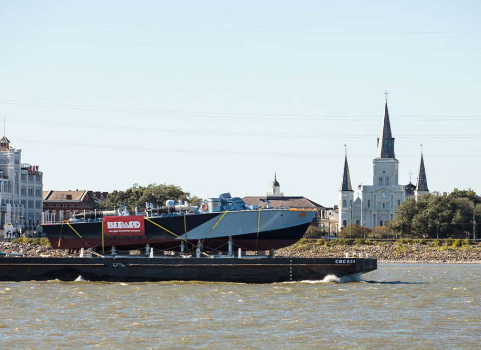 PT-305 being transported by barge