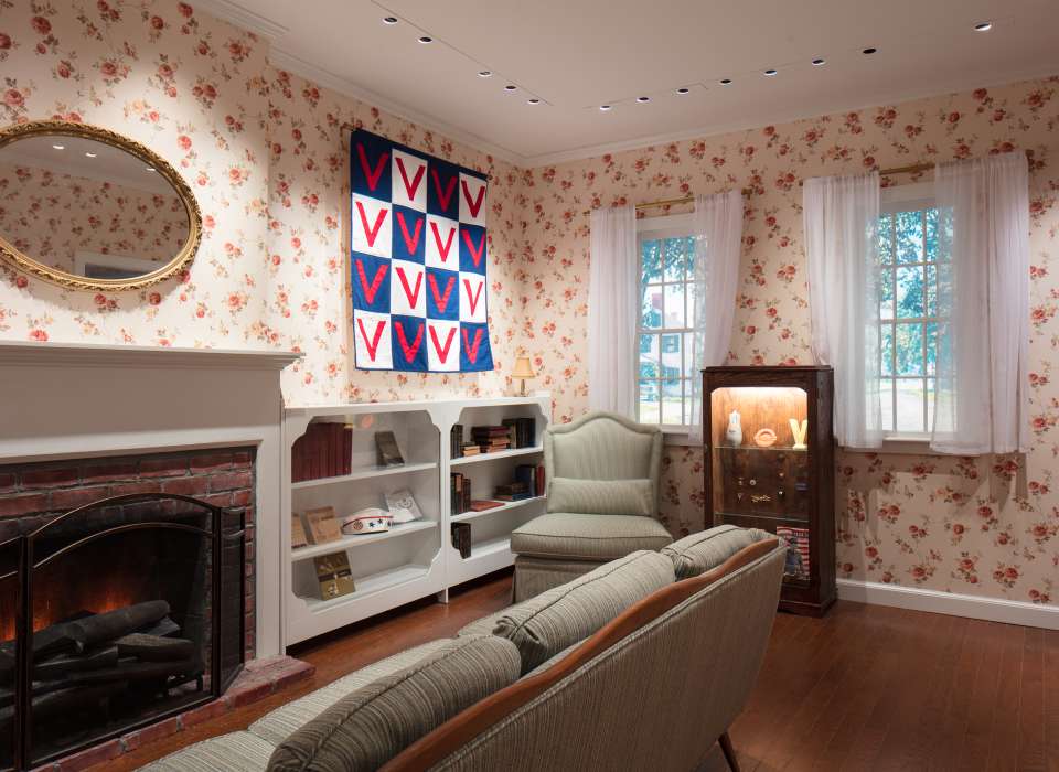 War Affects Every Home gallery, WWII-era living room with Victory quilt, Arsenal of Democracy