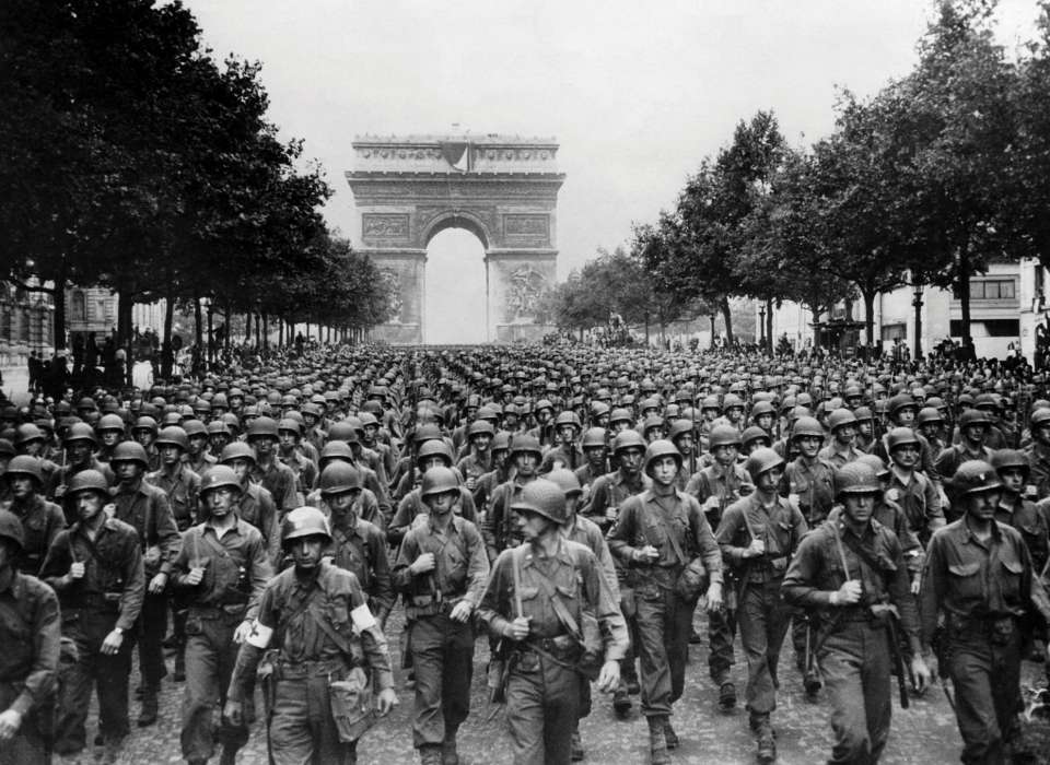 Troops in front of the Arc de Triomphe, Paris, WWII