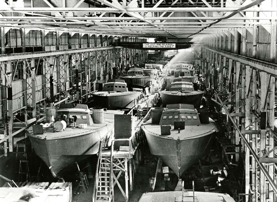 PT Boats lined up in factory in New Orleans during WWII