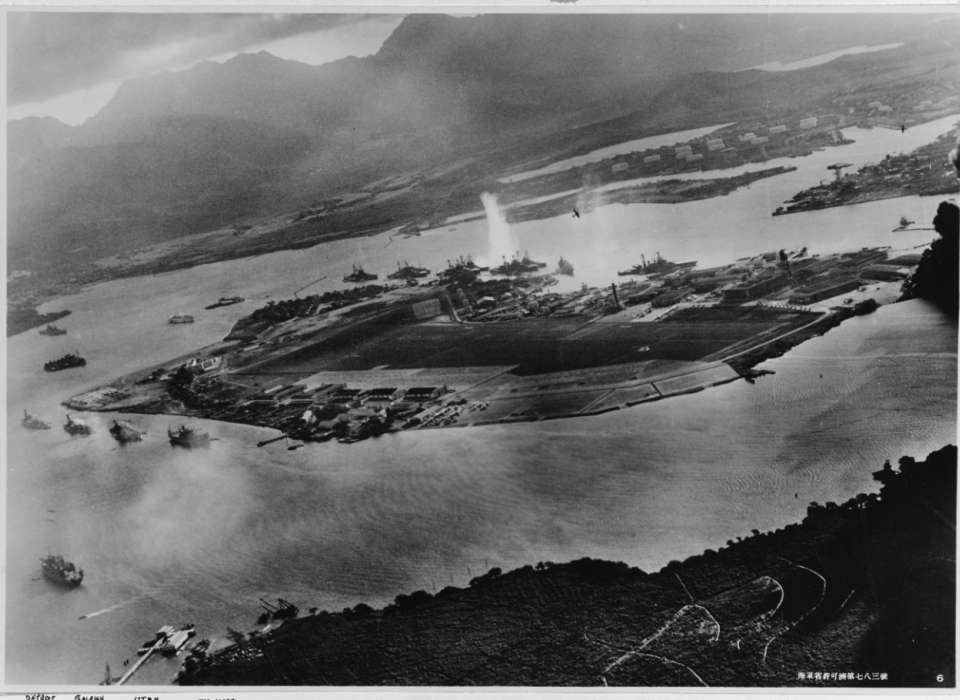 Photograph taken from a Japanese plane during the torpedo attack on ships moored on both sides of Ford Island.