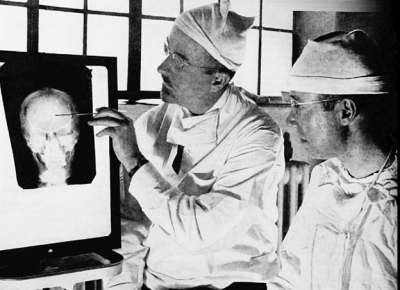 Walter Freeman and James Watts planning lobotomy in 1941, via Wikimedia Commons