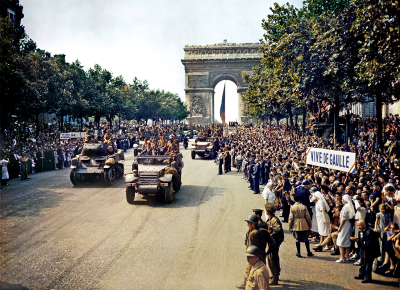 Crowds of French patriots line the Champs-Élysées to view Free French tanks and halftracks 