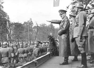 Adolf Hitler receives a parade of German troops in Warsaw