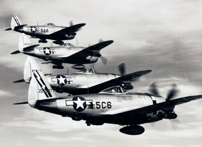 A formation of Republic P-47s prowl for targets