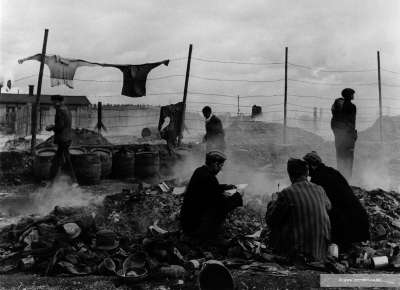 Freed prisoners at Dachau scavenging in the dump.