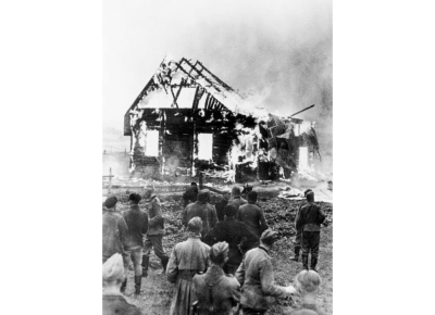 German soldiers watch as a synagogue in Lithuania burns