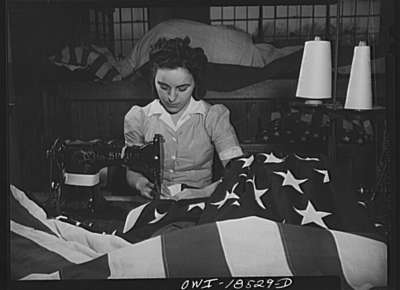 Sewing the edge of an American flag at the Annin Flag Company