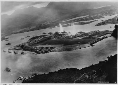 Photograph taken from a Japanese plane during the torpedo attack on ships moored on both sides of Ford Island.
